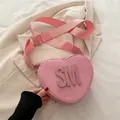 Pink heart-shaped PU leather crossbody bag with SM letter and wide woven strap - Pink