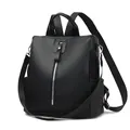 Minimalist black lychee pattern leather backpack with silver zippers and side pockets - Black