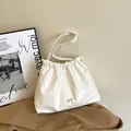 White pleated cloud tote bag with chic bow detail and slim shoulder strap for women - White
