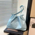 Sky blue pleated cloud tote bag with drawstring and silver bow pendant charm - Blue