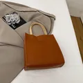 Minimalist brown tote bag with off-white contrast handles and stylish contrast stitching - Brown