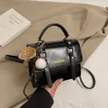 Black vintage briefcase style handbag with leather texture and baseball charm decoration - With Pendant / Black