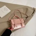 Mini light pink glossy handbag with gold Fashion text and adjustable shoulder strap - Without Pendant / Pink