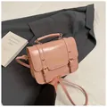 Pink PU leather messenger bag with gold buckles and detachable crossbody strap - Pink