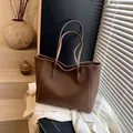 Large dark brown tote bag in pebbled leather finish for women on a white jacket - Khaki Without Pendant