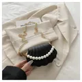 Chic black shell-shaped mini crossbody bag with pearl handle and gold chain strap - Black