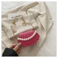 Mini shell cross-body bag in rose pink PU with pearl handle and golden chain - Pink
