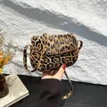 Compact leopard print saddle bag with textured PU leather and adjustable strap - Leopard Brown