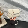 Minimalist cream white leather saddle crossbody bag with gold hardware and fine strap - White