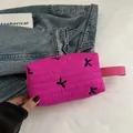 Magenta quilted clutch bag with black bow embroidery and side strap handle - Rose Pink