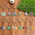 12-pack football themed PVC keychains with assorted sports slogans and trophy designs - Soccer Theme Soft Keychain