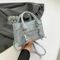Light blue minimalist handbag in PU leather with textured finish and shoulder strap - Blue