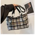 Detail of tweed tote bag with black and white plaid pattern and silver ring handles - Black Plaid