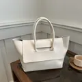 Minimalist cream white leather tote bag with unique cylindrical handles for daily commute - Off White