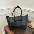 Minimalist black matte large capacity tote bag with unique top handle for daily commuting - Black
