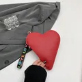 Red heart-shaped purse in lychee grain leather with colorful LOVE letter strap - Red
