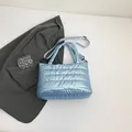 Light blue quilted space cotton crossbody bag with metallic finish and shoulder strap - Blue