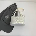 Chic silver quilted puffer bag with glossy metallic finish and adjustable crossbody strap - White