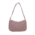Pink crescent underarm bag with all-over M-letter pattern and adjustable strap - Pink