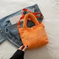Vibrant orange corduroy crossbody bag with soft texture and white snap closure - Orange