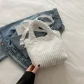 White corduroy crossbody tote bag with ruffled handles and adjustable shoulder strap - White