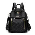 Chic black nylon women backpack with diamond quilting and gold hardware accents - Black