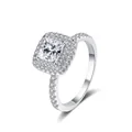 Close-up of a princess cut moissanite ring with halo setting in 925 sterling silver - Size 5 / D Color
