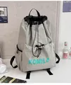 Macro detail of lightweight grey drawstring bag with KOMILO logo on nylon fabric - Large / Single Bag / Gray