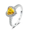 925 silver heart ring with yellow moissanite and side diamonds on white background - Gold