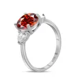 Macro side view of S925 silver ring with 3CT red oval stone and white pear accents - US 5 / Red