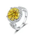 Detailed view of the 5-carat round moissanite ring with halo setting and paved silver band - Size 5 / Gold Yellow