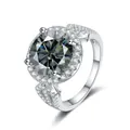Macro view of a 5-carat round moissanite ring with halo setting and pavé silver band - Size 5 / Gray