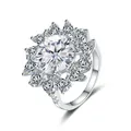 Sunflower moissanite ring with round center stone and pear-cut silver petals - Size 5 / D Color
