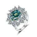 S925 silver ring featuring a blue-green round stone with pear-cut halo accent - Size 5 / Teal