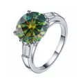 Elegant 925 sterling silver ring featuring a 5ct round green moissanite with side accents - Dark Green