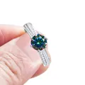 Blue moissanite engagement ring in silver with peacock blue fire and six-prong setting - Seven Colors