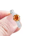Classic silver ring with six-prong setting featuring a brilliant round orange stone - Fanta Orange