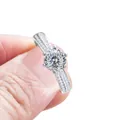 Blue moissanite engagement ring in sterling silver with six-prong setting and side diamonds - 100-Facet Cut