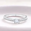 Classic S925 sterling silver moissanite ring with round four-prong setting on pink base - White