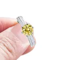 Elegant silver ring with six-prong yellow round-cut moissanite and side diamond accents - Lemon Yellow