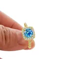 S925 sterling silver halo ring with a round blue moissanite in a gold finish - US 5 / Original Blue