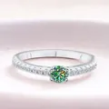 Elegant S925 sterling silver ring featuring a round green moissanite in a classic four-claw setting - Teal