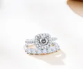 Detail of 925 sterling silver two-piece ring set with round halo moissanite stones - Size 5 / White with White Facet