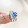 Luxury 6.5ct blue moissanite sterling silver ring set with round main stone and side band - Sapphire Blue