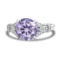 925 silver ring featuring a large round purple gemstone with intricate side carvings - Light Purple