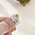 Macro detail of S925 hallmark on silver ring featuring a yellow moissanite stone - Gold Yellow