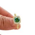 Luxurious gold ring featuring a 1ct round green moissanite stone and diamond halo - US 5 / Dark Green