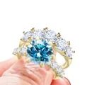 Luxe stapelbare 925 zilveren ringenset in goud met ronde blauwe moissanite steen - Maat 5 / Aqua