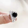 Luxury sterling silver ring set featuring a large round black moissanite stone - Black