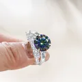 Luxury sterling silver 6.5ct moissanite ring set with round main stone and side baguettes - Rainbow